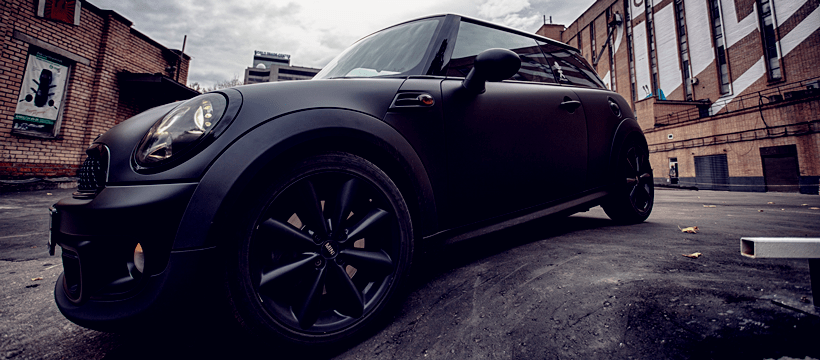 side look of a Mini Cooper without a cargo carrier