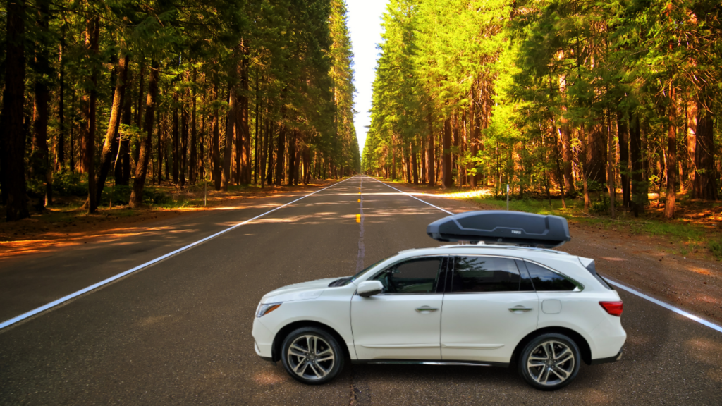 thule cargo boxes on white acura mdx