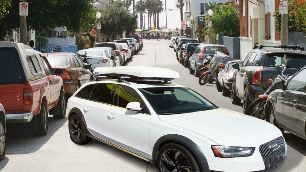 white Audi A4 with white roof box