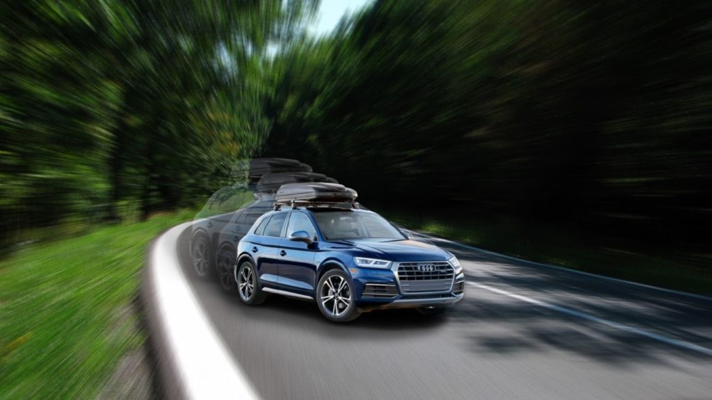 audi q5 in high-speed with a cargo box