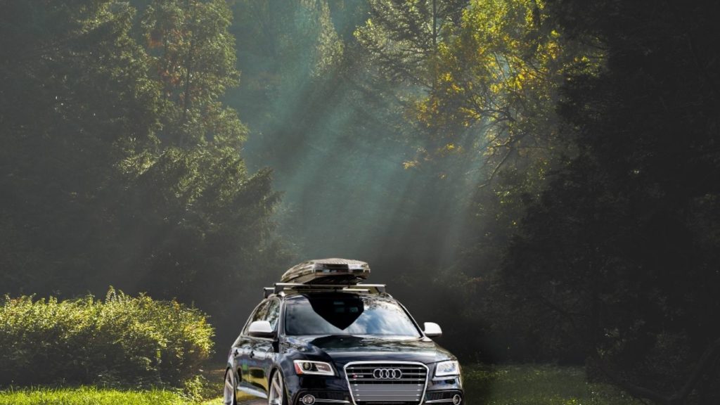 audi q5 in woods with a cargo box
