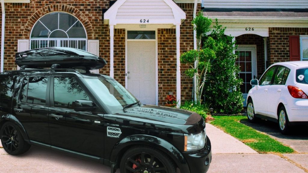 I park my black Land Rover SUV outside my neighbor's home, and I wait for her to pack her belongings into the Thule black cargo box for our honeymoon road trips across the country.