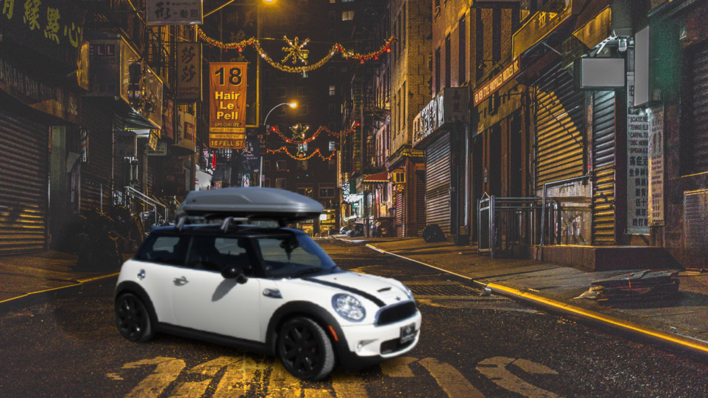 I park my mini cooper in the back street with gray cargo box on top of it