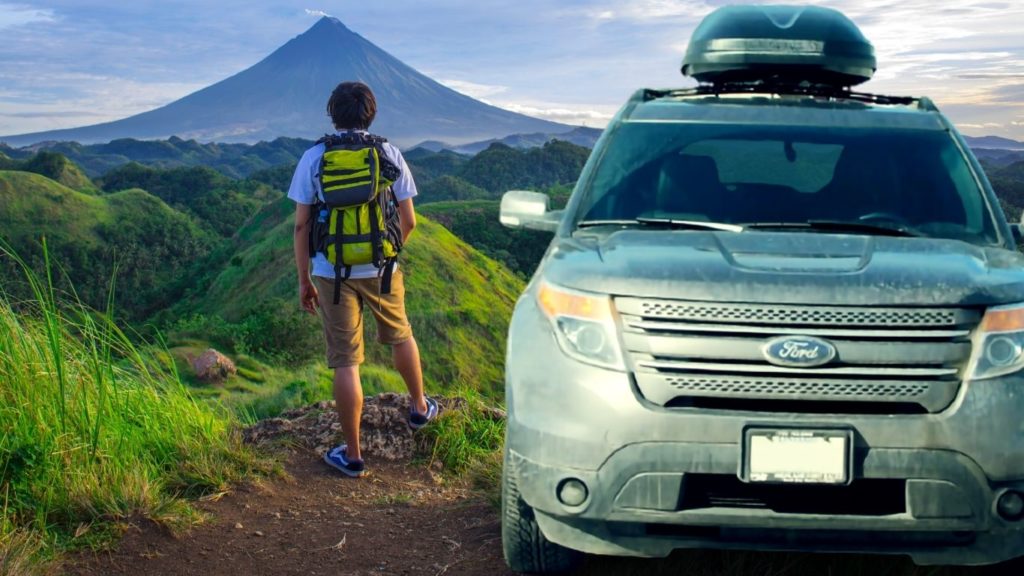 He drives his Ford Explorer to the mountain zone and observe the volcano's activities with all his belongings in the roof box.