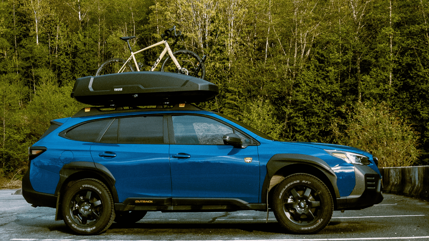 Motion XT and bike rack on top of Subaru Outback 2022