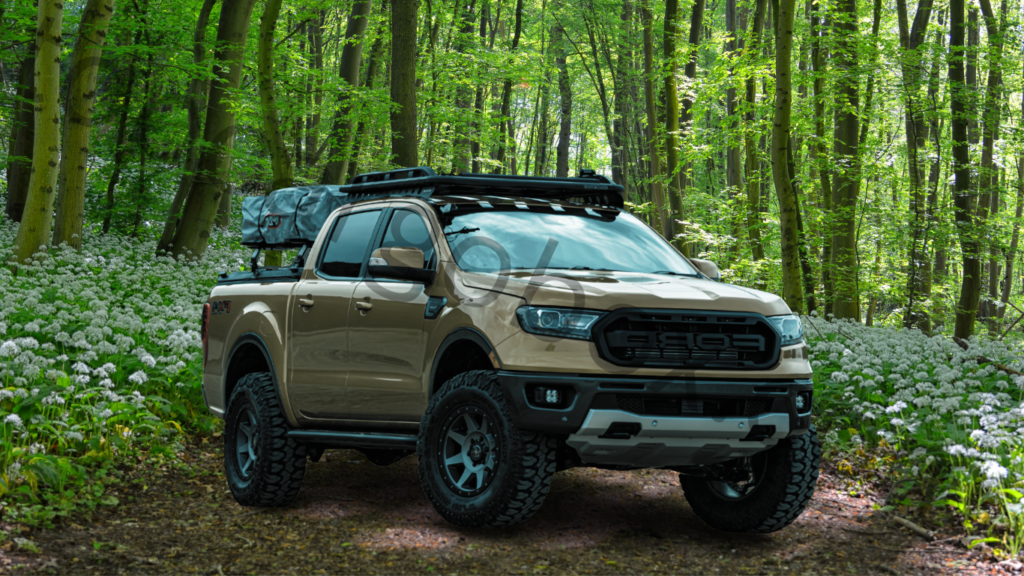 2021 Ford Ranger with roof racks and trunk racks in forest