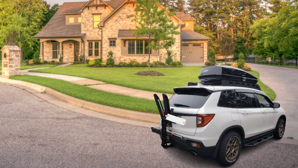 white SUV with black Yakima GrandTour 16 roof box