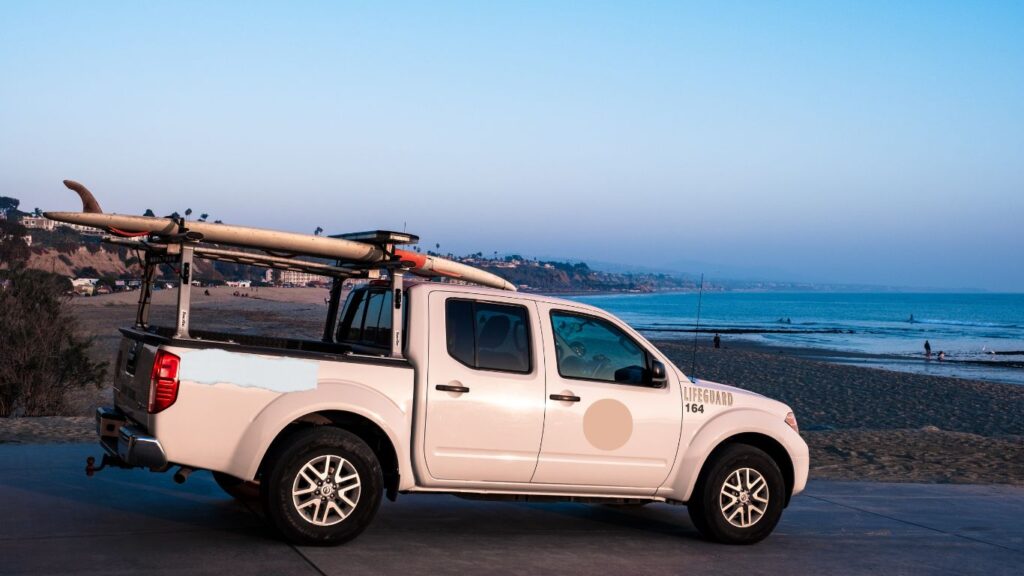 ladder racks in use on white LIFEGUARD Toyota truck