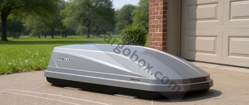 "Silver Perflex rooftop cargo box mounted on a SUV with skis and gear loaded inside"