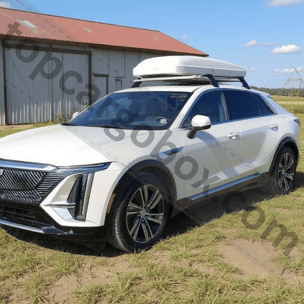 Close-up of hands tightening a roof cargo box clamp onto crossbars, emphasizing proper installation to meet the Lyriq’s 165-pound weight limit.