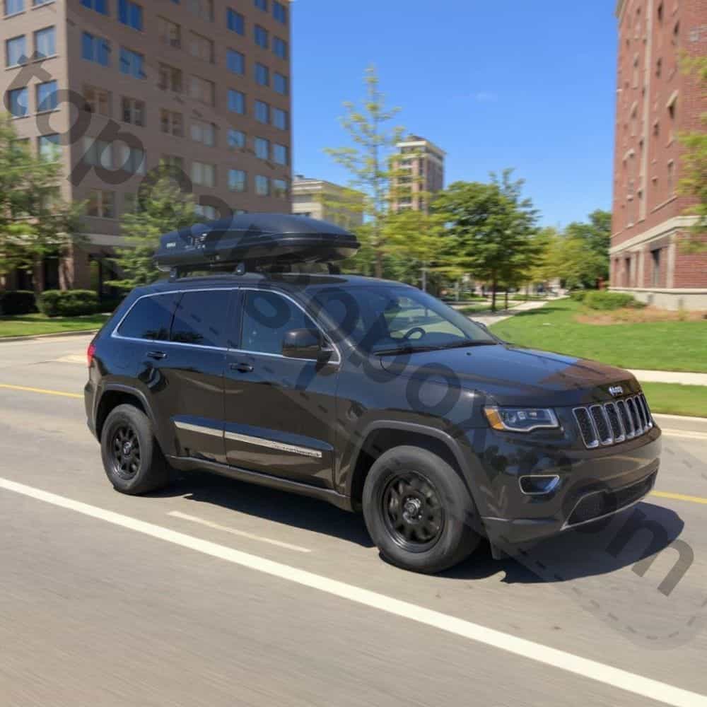 Side view of a Thule 614 Pulse cargo box with the passenger-side lid open, revealing spacious interior storage for travel gear.
