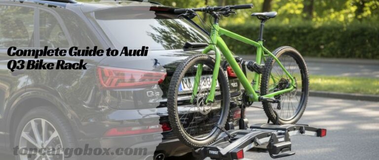 A sleek black Audi Q3 with two mountain bikes securely mounted on a platform-style hitch bike rack.